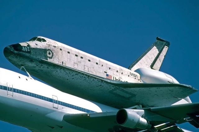 BOEING 747-100 (N905NA) - The space shuttle orbiter Columbia OV-102 was delivered to Air Force Plant 42 at Palmdale, California on Saturday, September 25, 1999 on the back of Boeing 747 Shuttle Carrier Aircraft (SCA) N905NA. It was housed at Boeings Orbiter Assembly Facility during an eightteen-month orbiter maintenance down period.