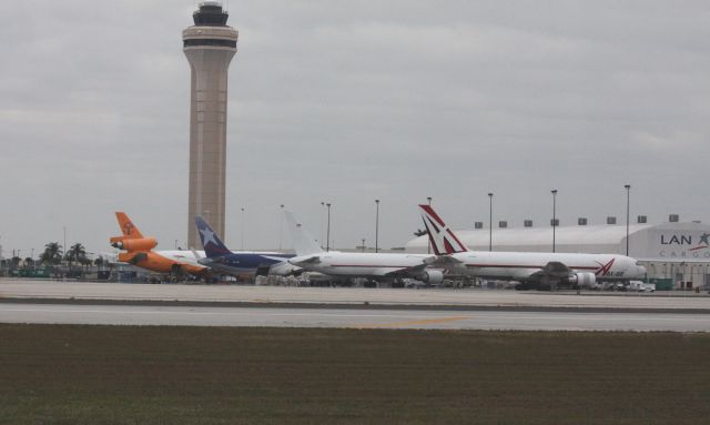 BOEING 767-200 (N747AX) - Lineup of freighters at Miami