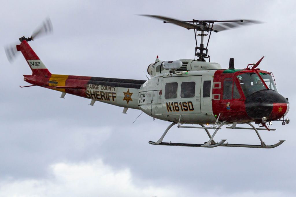 Bell UH-1V Iroquois (N181SD) - Departing through some rain
