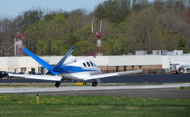 Cirrus Vision SF50 (N228BS) - On the departing runway is this 2018 Cirrus Vision SIngle Engine Jet in the Spring of 2019.