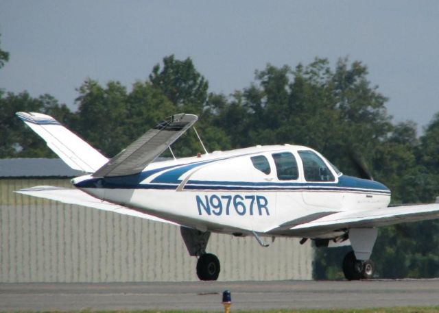 Beechcraft 35 Bonanza (N9767R) - 1959 Beech M35 about to lift off of 14 at Downtown Shreveport.