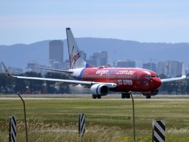 Boeing 737-700 (VH-VBO) - On taxi-way, heading for take off on runway 05.