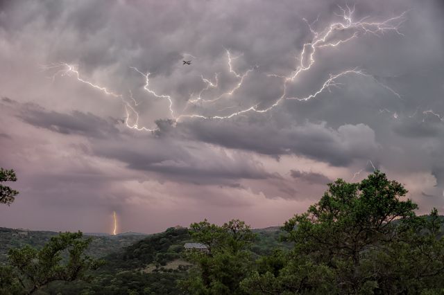 — — - This is six images stacked. I was shooting lightning and this Spirit Airlines 737 broke through the clouds. Shot a 1/30 so motion artifact. I bet is was a rockin' ride into San Antonio.