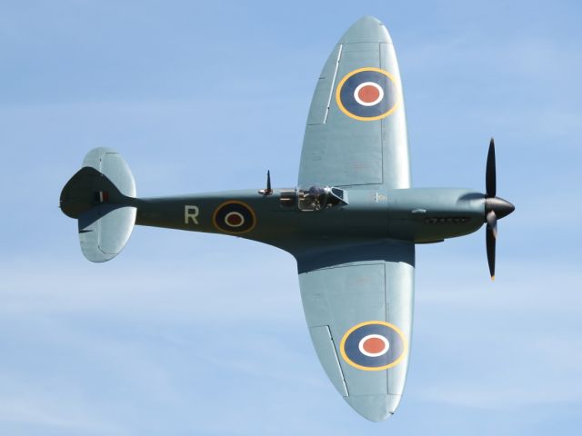 — — - Flypast of a Supermarine Spitfire at Old Warden Aerodrome.