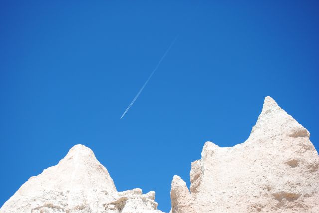 — — - Jet crossing the Badlands over South Dakota