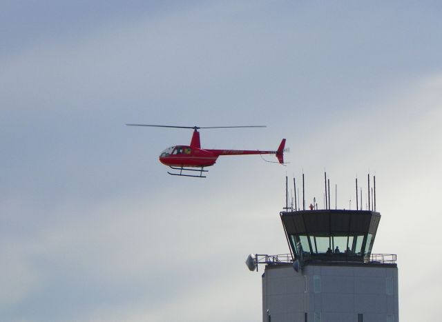 Robinson R-44 — - Landing near the tower.