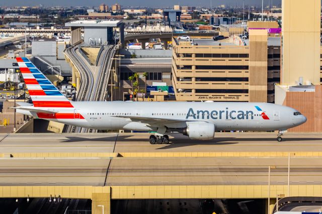 Boeing 777-200 (N779AN) - An American Airlines 777-200 taxiing at PHX on 2/13/23, the busiest day in PHX history, during the Super Bowl rush. Taken with a Canon R7 and Canon EF 100-400 II L lens.