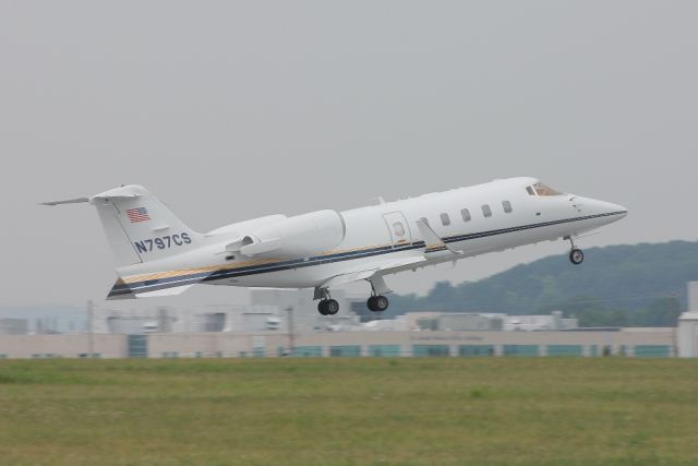 Learjet 60 (N797CS) - A Learjet 60 departs runway 13 before strong rain showers move in