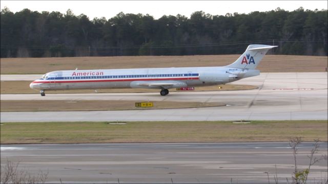 McDonnell Douglas MD-83 (N972TW) - An American Airlines McDonnell Douglas MD-80 landing at Raleigh-Durham Intl. Airport. This was taken from the observation deck on January 17, 2016 at 4:40 PM. This is flight 1348 from DFW.