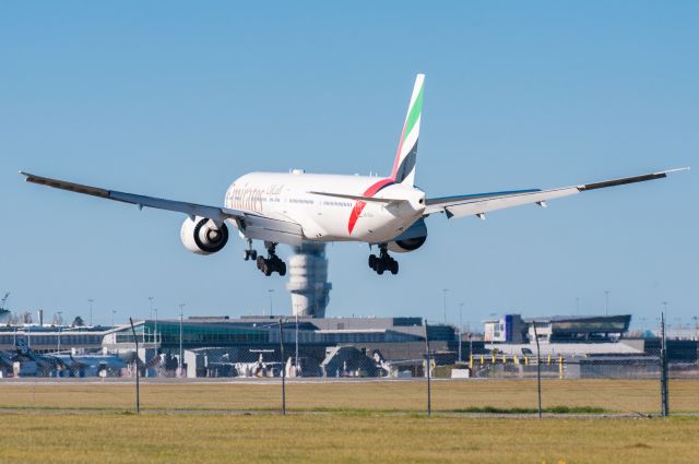 BOEING 777-300 (A6-EGH) - A big Emirates B777-300ER landing at Christchurch International Airport, on the tower roof.