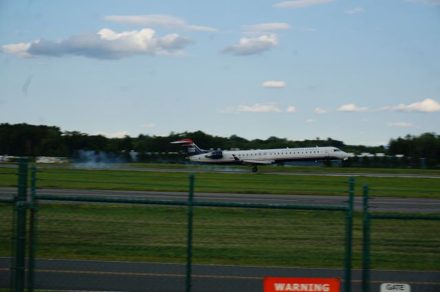 Canadair Regional Jet CRJ-900 (N924FJ) - Mesa Airlines touches down on 19 at Albany coming in from Charlotte.