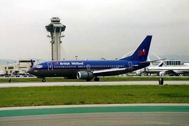 BOEING 737-300 (G-SMDB) - KLAX - rare photo of a British Midland 737 300 at LAX - This jet landed 25 L and turned left towards Cargo. It stopped for 5 minutes then rolled to 25 L for a departure. Total time on the ground 15 minutes. Later I learned this was a test flight from Seattle before delivery.