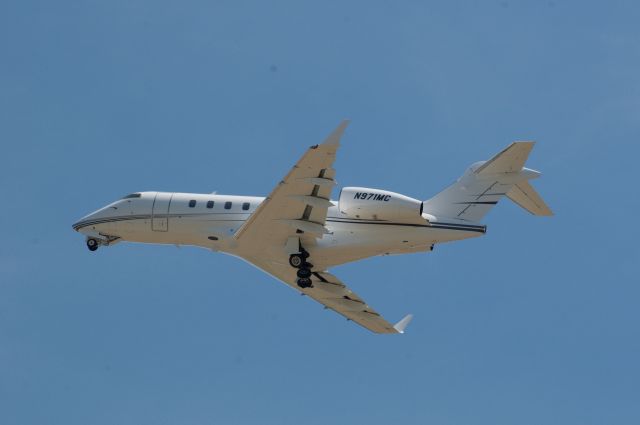 Bombardier Challenger 300 (N971MC) - Taking off Runway 31 for a straight departure up Provo Canyon to Heber (KHCR) for a very short flight. br /Best viewed in full! 