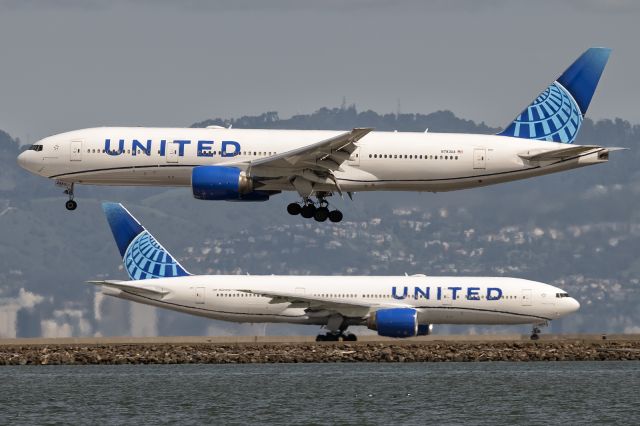 Boeing 777-200 (N783UA) - 29th March, 2025: Flight UA 034 from Kansai International Airport is about to touch down at SFO more than six hours before it departed Japan! Company ship (N223UA) is seen taxiing for departure to Beijing as flight UA 888. 