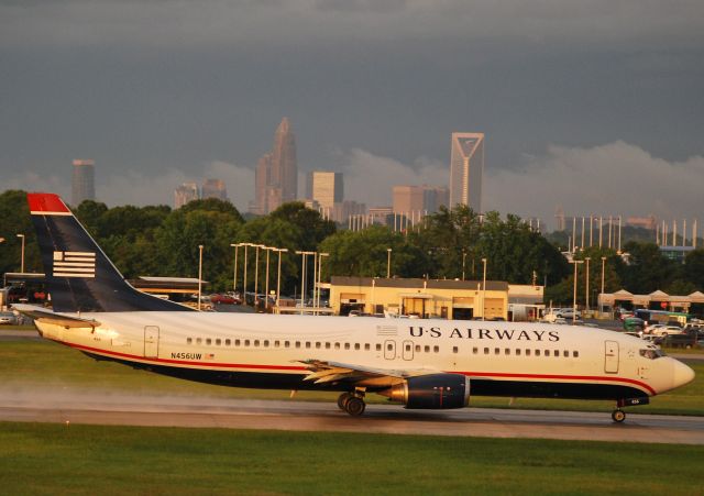 BOEING 737-400 (N456UW) - Takeoff roll 18C just after a passing storm - 5/27/11