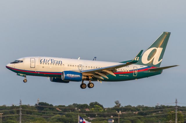 Boeing 737-700 (N329AT) - Runway 04 arrival. August 2014