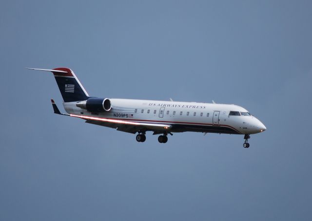 Canadair Regional Jet CRJ-200 (N209PS) - On final for 23 just after heavy winds and rain - 4/8/10