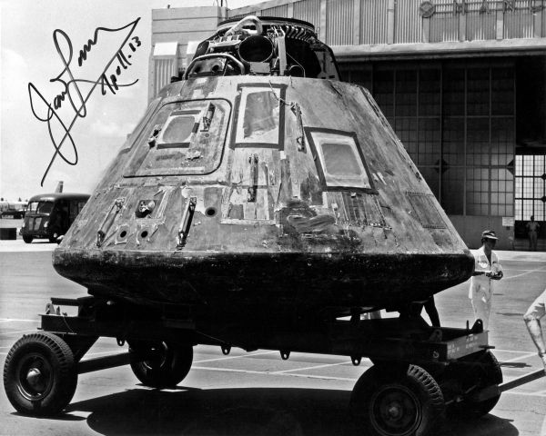 — — - Apollo 13 in front of Hanger 5 at Hickam AFB Hawaii awaiting transport back to Houston, April 1970. Signed by James Lovell February 25, 1996. 