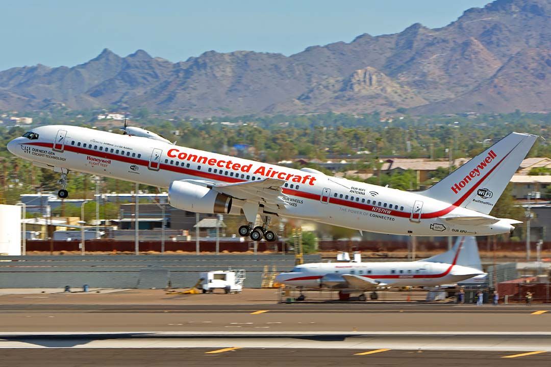 Boeing 757-200 (N757HW) - Honeywell Boeing 757-225 N757HW engine testbed departing Phoenix Sky Harbor for the Experimental Aircraft Association airshow in Oshkosh, Wisconsin on July 22, 2018. It has a TPE331-14 turboprop engine installed on its test pylon. A spinner and sharks mouth and eyes inspired by the P-40s of the Flying Tigers have been addded to the nacelle.