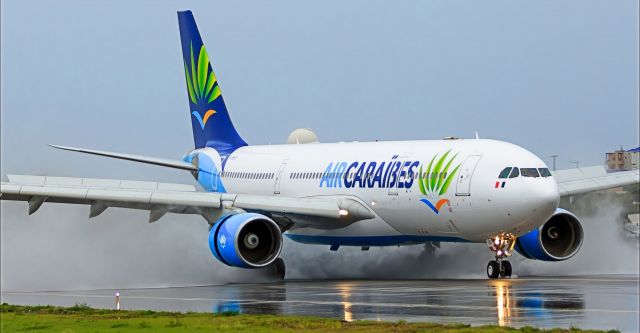 Airbus A330-200 (F-HHUB) - Air Caraïbes Airbus A330-200 F-HHUB landing at TNCM St Maarten with some perfect breaking action going on there!!br /13/10/2018