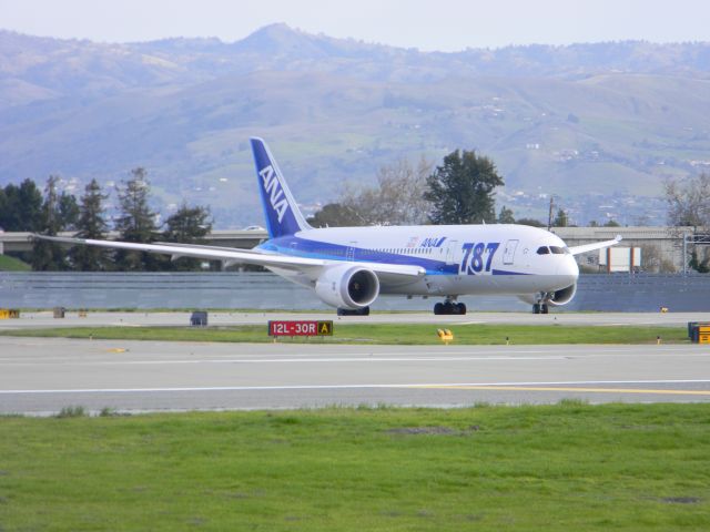 Boeing 787-8 (JA813A) - Taken from Airport Blvd. on Friday, January 11th, on its inaugural  flight from Tokyo!