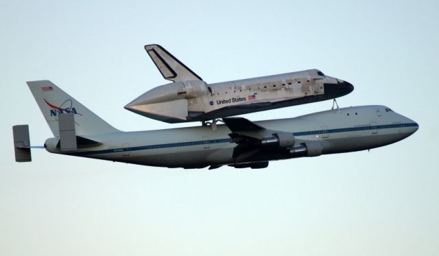 BOEING 747-100 (N905NA) - Space Shuttle Discovery leaving KTTS just after sunrise on 17Apr2013 on its final flight to the National Air and Space Museum on BSCA N905NA.