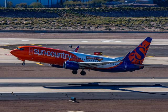 Boeing 737-800 (N831SY) - A Sun Country 737-800 taking off from PHX on 1/25/23. Taken with a Canon R7 and Tamron 70-200 G2 lens.