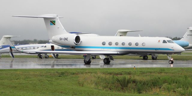 Gulfstream Aerospace Gulfstream V (5H-ONE) - A Gulfstream GV-SP owned by the United Republic of Tanzania taxiing in light rain for departure at Carl T. Jones Field, Huntsville International Airport, AL - July 8, 2021.