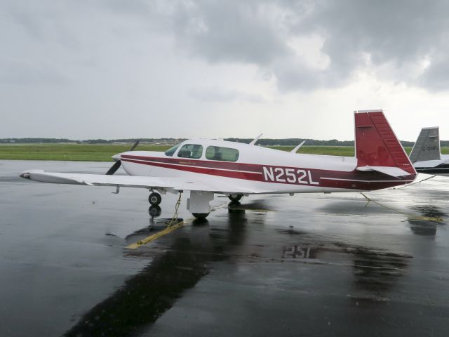 Mooney M-20 (N252L) - Gathering for the Mooney arrival at Oshkosh. 18 August 2015.