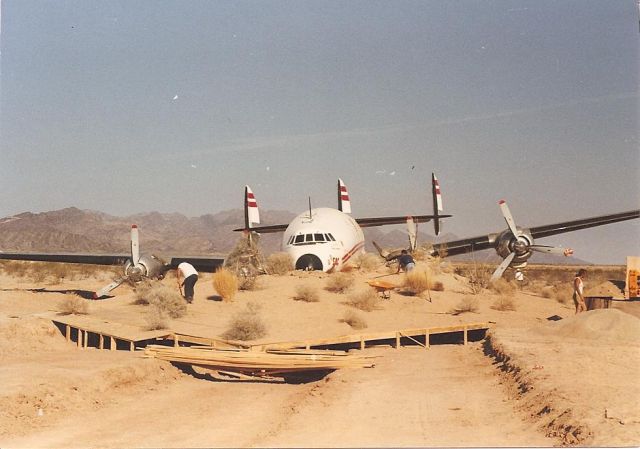 Lockheed EC-121 Constellation (N6937C) - Burrying a Connie 1990. Staging for a movie shot.