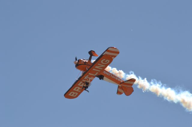 — — - Breitling Wingwalkers Boeing Stearman performs over the Australian International Airshow 2013.
