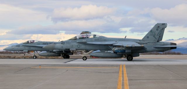 McDonnell Douglas FA-18 Hornet (16-6623) - A pair of Hornets (166623 ... F/A-18F ... VFA-11 "Red Rippers" / NAS Oceana .... piloted by Lt Kyle "Dobby The House Elf" Anderson; also 164900 ... F/A-18C ... VMFA-312 "Checkerboards" / MCAS Beaufort) prepare to light up the burners and launch from NAS Fallons runway 31L.