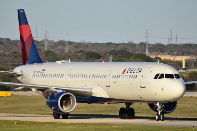 Airbus A321 (N359DN) - Long landing, beacon, and some awesome light made for a nice shot!