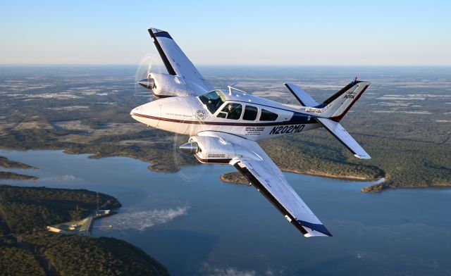 Beechcraft 55 Baron (N202MD) - AOPA's Dual fuel demonstrator: Unleaded fuel goes in the left wing and feed the left engine. br /Leaded avgas (100LL) will go in the right wing and feed the right engine.