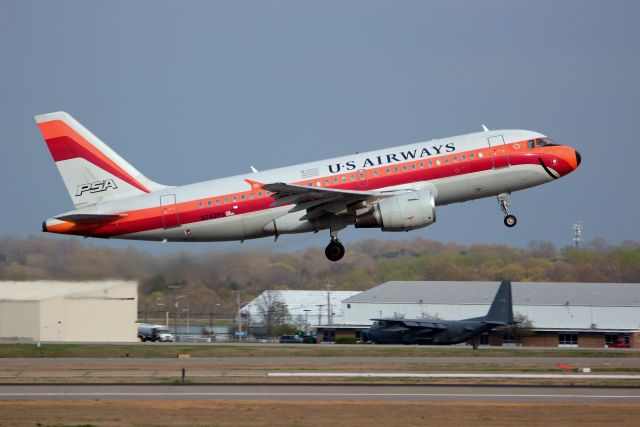 Airbus A319 (N742PS) - US Airways A319 in PSA colors taking off in Nashville on April 9, 2013.