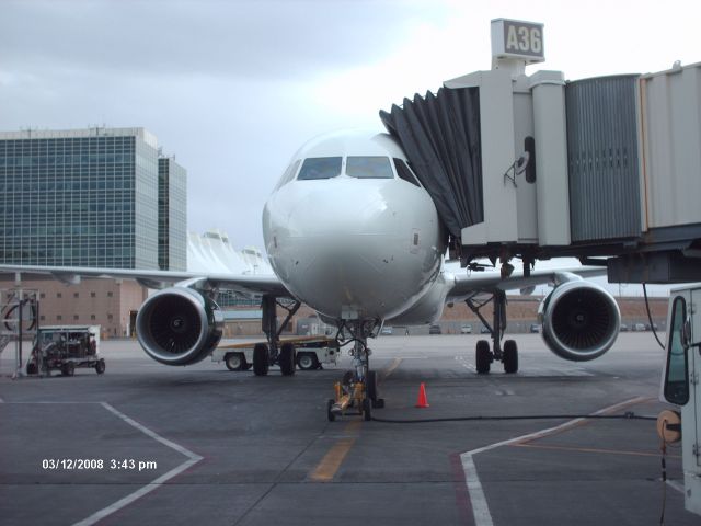 Airbus A320 (N201FR) - Frontier Airlines first A320 sitting at gate A36 at KDEN. Just came in from KDCA. In this photo, this plane has only been in service for about a week.