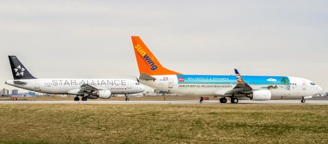 Boeing 737-800 (C-GKVP) - Sunwing 738 C-GKVP + Air Canada A320 C-FDRH Star Alliance hold short waiting for clearance for departure Toronto YYZ