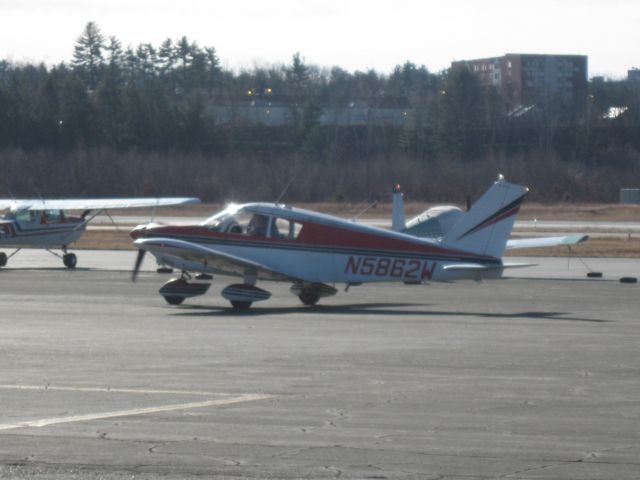 Piper Cherokee (N5862W) - Taxiing by the airport restaurant.