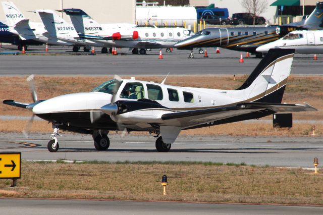 Beechcraft Baron (58) (N96WF) - 1990 Beechcraft 58 Baron crossing runway 34 after arriving from KMSY. Photo taken on 3/4/2021.