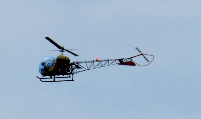 — — - Was plane spotting the planes landing at KSDF when the fellow flew directly over me at about 30 feet flying parallel to Blue Lick airport. Made a port turn at the end of the grass strip and headed south. 