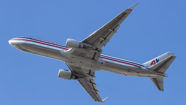 — — - American Airlines, B763, departs from runway 027L at LHR.