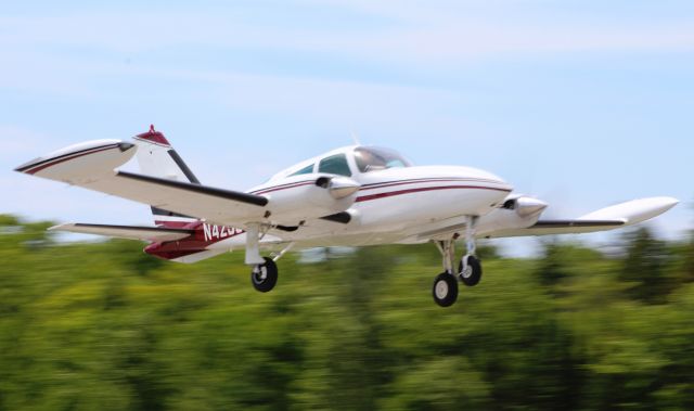 Cessna 310 (N4258C) - Taking off runway 8 at MCD enroute to LDM. Notice the wave from the pilot