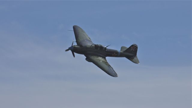 N112VW — - Flying Heritage Collections Ilyushin IL-2M3 Shturmovik makes a pass over runway 34L during fly day 9/15/12.