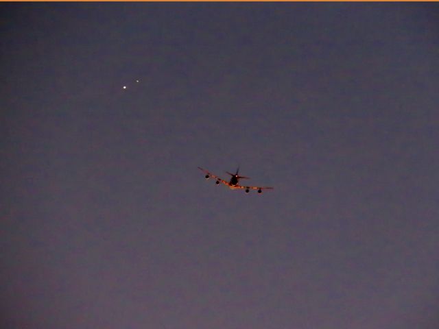 — — - I was setting up to take some pictures of the conjunction tonight. Saw this UPS Boeing 747 climbing so picked up my Canon SX60HS PowerShot, set it to 65X optical zoom. Time was 5:52PM. Lo and Behold, above and just to the left were Saturn and Jupiter! No photoshopping, slight cropping 