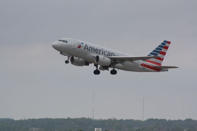 Airbus A319 (N755US) - N755US taking off runway 23R