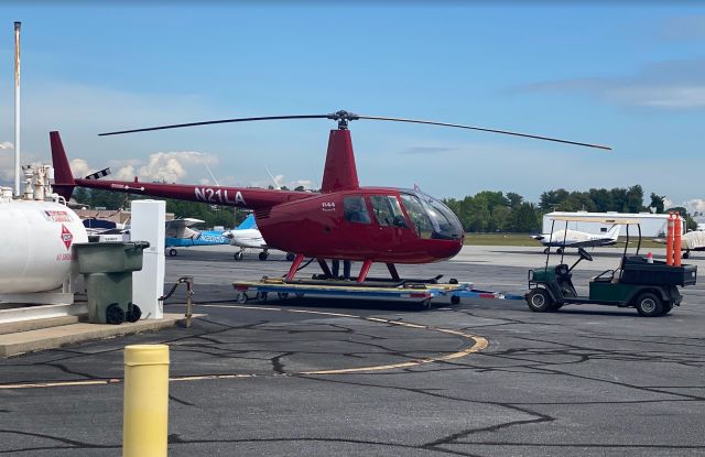 Robinson R-44 (N21LA) - R44 Raven II parked for being refueled at the South Ramp GMU