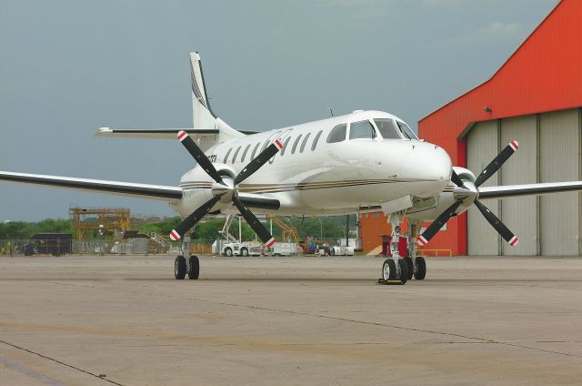 Cessna 402 (N767FA) - Completion Photo of Metro III S/N 767B, upon completion of 2 years of major mods and conversion to custom corporate configuration and extended range, etc. By: Candler & Associates, Inc., S.A., Tx.