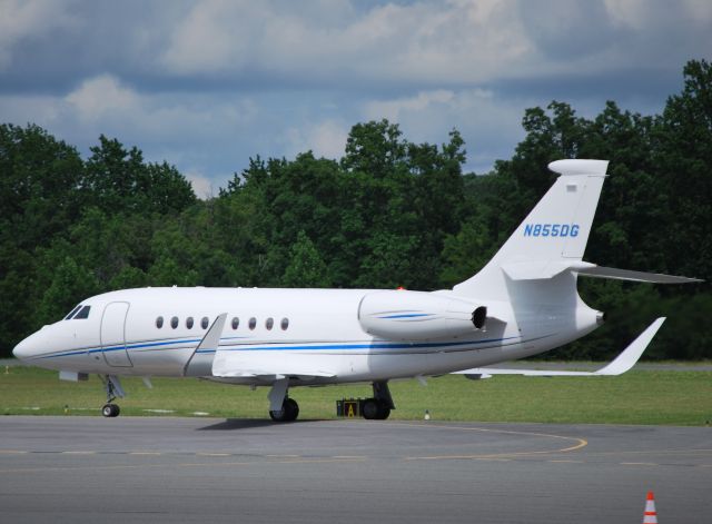 Dassault Falcon 2000 (N855DG) - DOLLAR GENERAL CORP taxiing to Hendrick Motorsports hangar to drop off passengers attending the Coca-Cola 600 at KJQF - 5/27/12