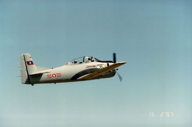 — — - Don Kendell getting airborne at Valleyfield in Trojan T-28D, for one of the races.