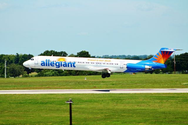 McDonnell Douglas MD-80 (N425NV) - On a hot and hazy summer afternoon, this Allegiant maddog MD-80 is only a few feet from main gear touchdown on runway 22 at Lexingtons Bluegrass International Airport.